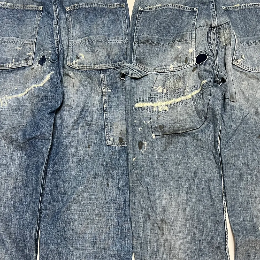 Proofing VS ZP SAINT Mxxxxxx SAINT_DENIM PANTS/PAINTER /BLUE Knife cut holes and splashed ink logging trousers Patch jeans Blue S-XL All accessories are molded and customized Super heavy work Washed and worn Knife cut holes Artificial ink splashed graffiti Genuine version Loose and stylish